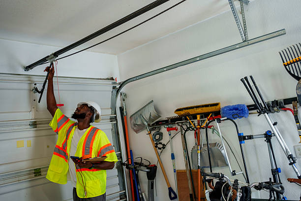 Professional Garage Door Panel Replacement technician working in Riley, KS